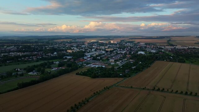 The town of Svitavy at sunset, panoramic drone view capturing buildings and residential areas in warm evening light. Aeriel view