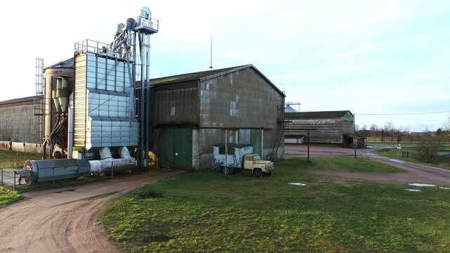 Soviet-era warehouse meets present-day tech in this calm rural Latvian scene