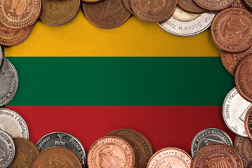 Coins on flag of Lithuania trading investment business currency concept
