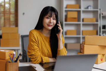 Startup small SME business, Young Asian woman holding smartphone call clenched celebrating victory...