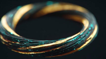 Close up view of a twisted metallic ring with gold and teal highlights on a dark background