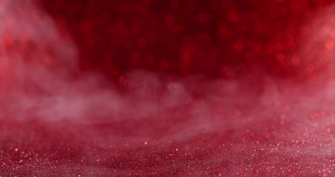Color particles. Ink fog. Defocused red crimson water glitter smog blend cloud sequins moving on abstract dark black art background.