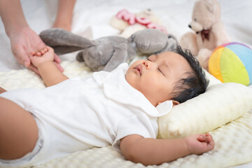 Sweet Dreams, Close-up of a Sleeping Baby in White Outfit, Adorable Infant Resting Comfortably with...