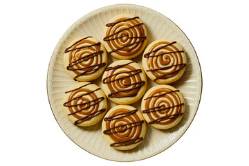 Caramel Swirl Halloween Cookies with Dark Chocolate Drizzle on Cream Porcelain Plate – Top View PNG