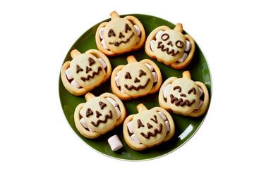 Smiling Jack-o’-Lantern Halloween Cookies on Green Plate – Top View PNG