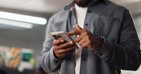 Hands, phone and scroll with business man in office for social media manager, communication and...