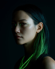 Fototapeta premium Cyberpunk Korean woman with tech eye, glowing green hair, futuristic style, confident expression