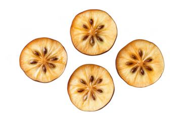 Four cross sections of dried apple slices showing seeds and star pattern isolated on transparent background
