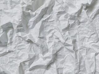 Crumpled white paper texture background with wavy surface. Crumpled white vintage paper surface texture for background. Wrinkled paper, abstract background. Paper background with copy space for text.