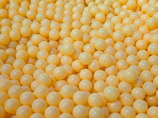 photo of ball pit, bubble, playground, yellow background, abstract background