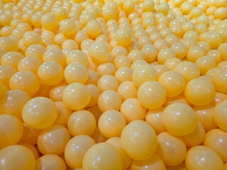 photo of ball pit, bubble, balls, playground, yellow, abstract background