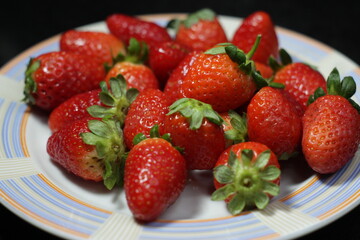 many strawberries on a plate