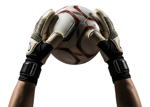 soccer goalkeeper holding up a ball after making a save
