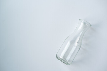 Empty Glass Bottle on White Background with Soft Shadow