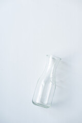 Empty Glass Bottle on White Background with Soft Shadow