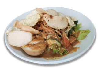 Authentic Indonesian culinary delight. A plate of gado-gado, a vibrant Indonesian salad, showcasing a harmonious blend of fresh vegetables, savory peanut sauce, and crispy crackers.