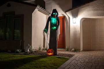 Spooky Greeter: Haunted Halloween Skeleton Welcomes Visitors with a Glowing Glow