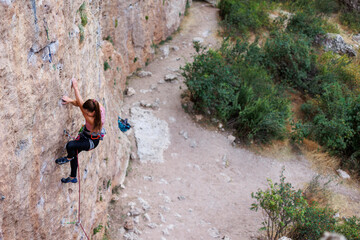 girl climber. rock climber on a difficult route.