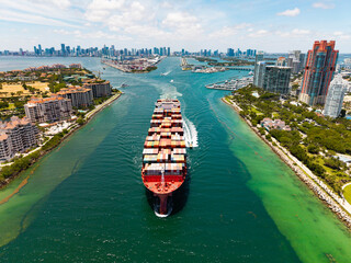 Shipping logistics. Commercial shipping. Top view. Cargo ship in sea, aerial view. Freight...