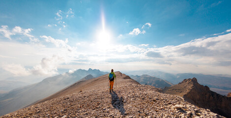 Adventure in the mountains. climber with a backpack in the mountains. Tourist traveling to the...