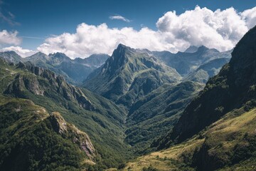 Fototapeta premium Lush mountain valley under a blue sky