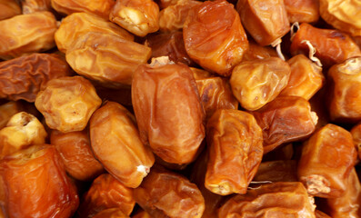 selective image of Pile of Kurma or Dates Fruits on the Karachi Ramadan market, fresh and dried dates background