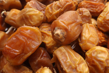 selective image of Pile of Kurma or Dates Fruits on the Karachi Ramadan market, fresh and dried...