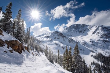 Fototapeta premium Snowy winter landscape of a ski resort in the Austrian Alps with frost-covered fir trees under a cold blue sky