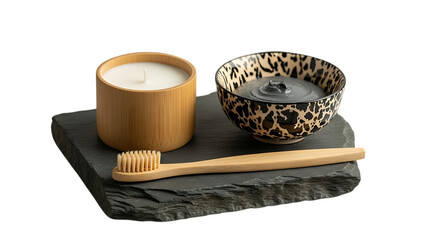 Natural bamboo toothbrush and candle in a spa setting