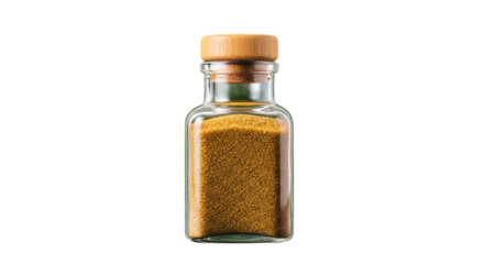 Small glass bottle filled with yellow granules against a blurred green leafy background