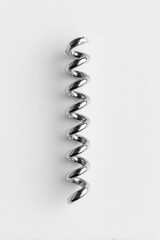 Metallic spiral coil on white background