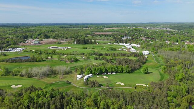 TPC Toronto Osprey Valley golf course on sunny day, wide drone shot
