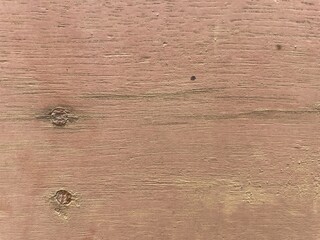 Textured wooden surface with natural grains and subtle imperfections.