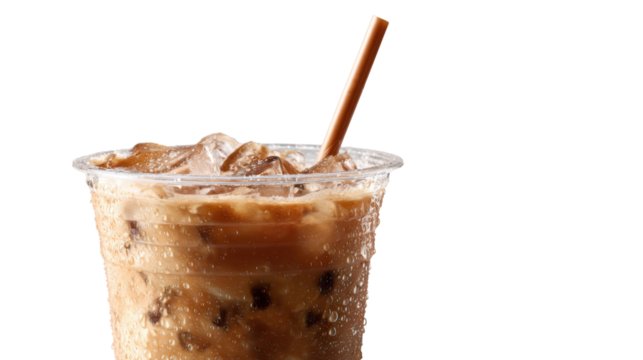 Refreshing iced coffee in a clear cup with ice cubes and a straw on a white isolated background.