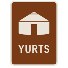 Unique yurt sign marking camping area in a natural setting with inviting design for outdoor enthusiasts