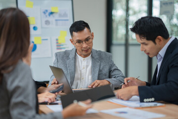 Group of business people are having a meeting at the office.