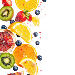 Colorful fruit slices and berries,  splashing down