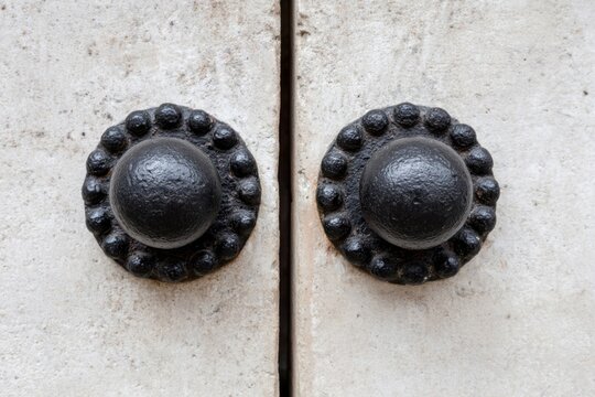 Ancient door knobs resembling celestial carvings, echoing Solstice's mystical quietude, industrial beauty, and whispering tales of bygone architectures