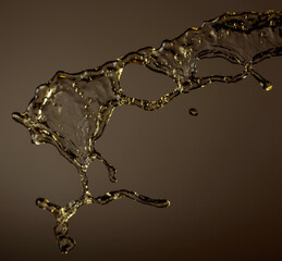 Splash of yellow transparent liquid.