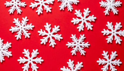A festive red Christmas background with sparkling snowflakes creates a perfect winter holiday decoration