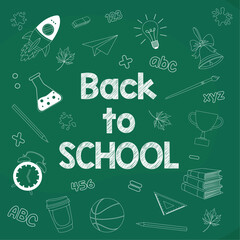 Back to school greeting card Chalk white drawings on green board School supplies