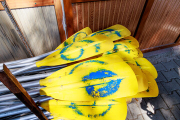 Rafting paddles are neatly folded and ready for use.