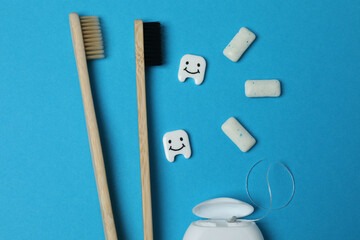mouthwash, toothbrush, dental care tools on blue background
