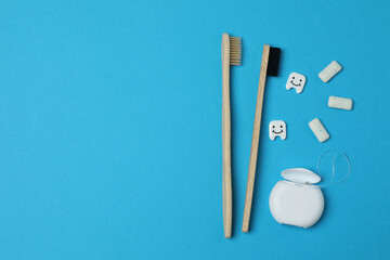 mouthwash, toothbrush, dental care tools on blue background
