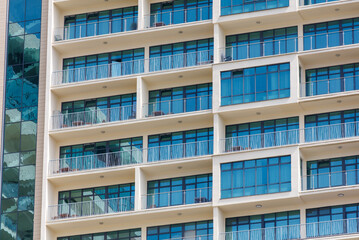 A tall building with many windows and balconies
