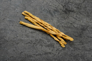 Grissini breadsticks on a gray background macro photo