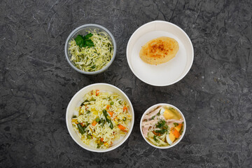 lunch soup, rice with vegetables and cutlet with coleslaw