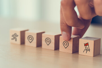 Career Path and Development Strategy Concept. Arranging wooden blocks with icons success roadmap...