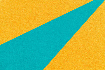 Abstract old yellow paper background with geometric turquoise rays, macro texture for banner, template, presentation