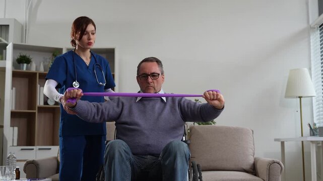 senior man doing exercise at clinic with physiotherapist. help of a personal trainer during a rehabilitation session.